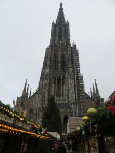 The Ulm Minster towers over the Christmas market in Ulm, Germany